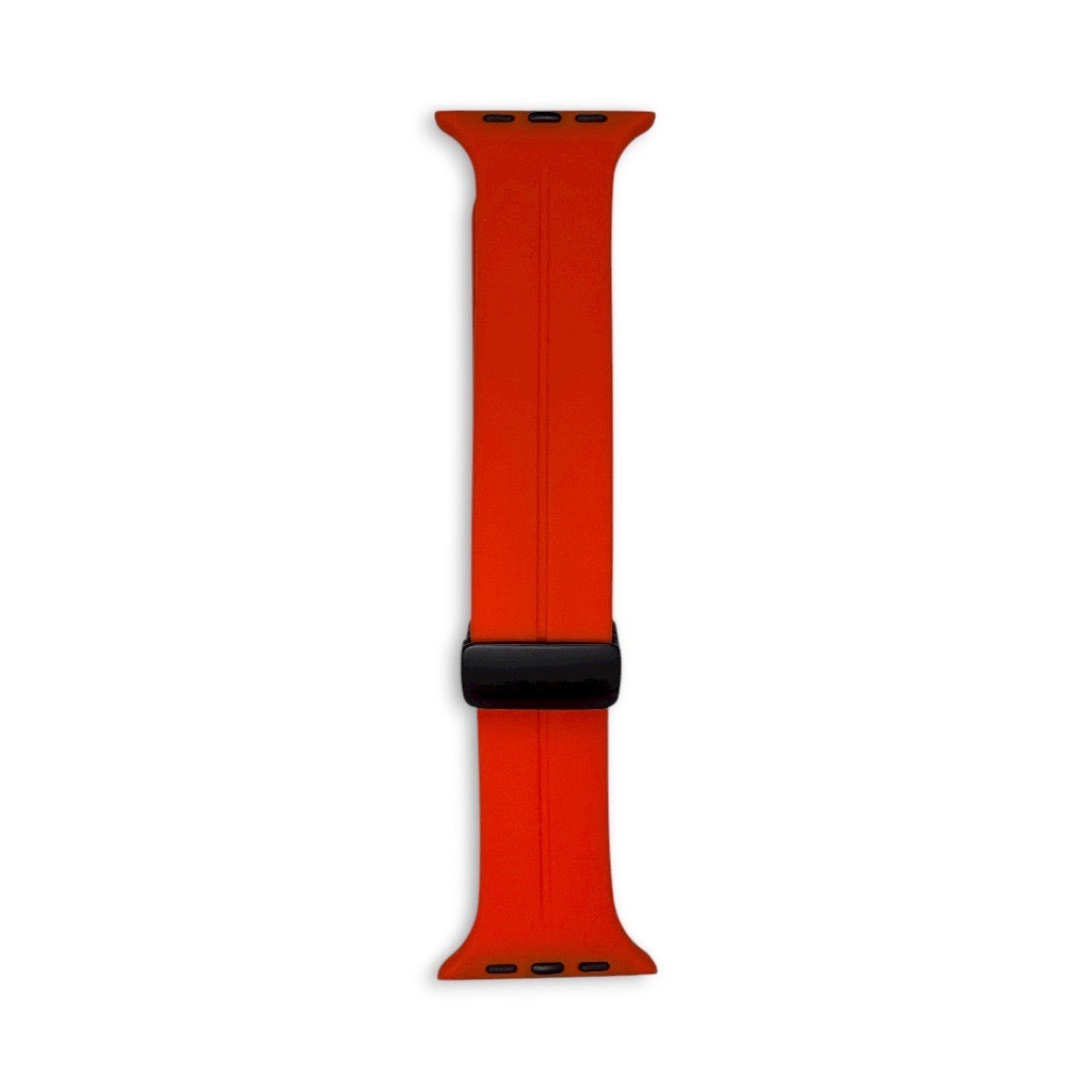 Orange apple watch strap with black magnetic buckle band on a white background