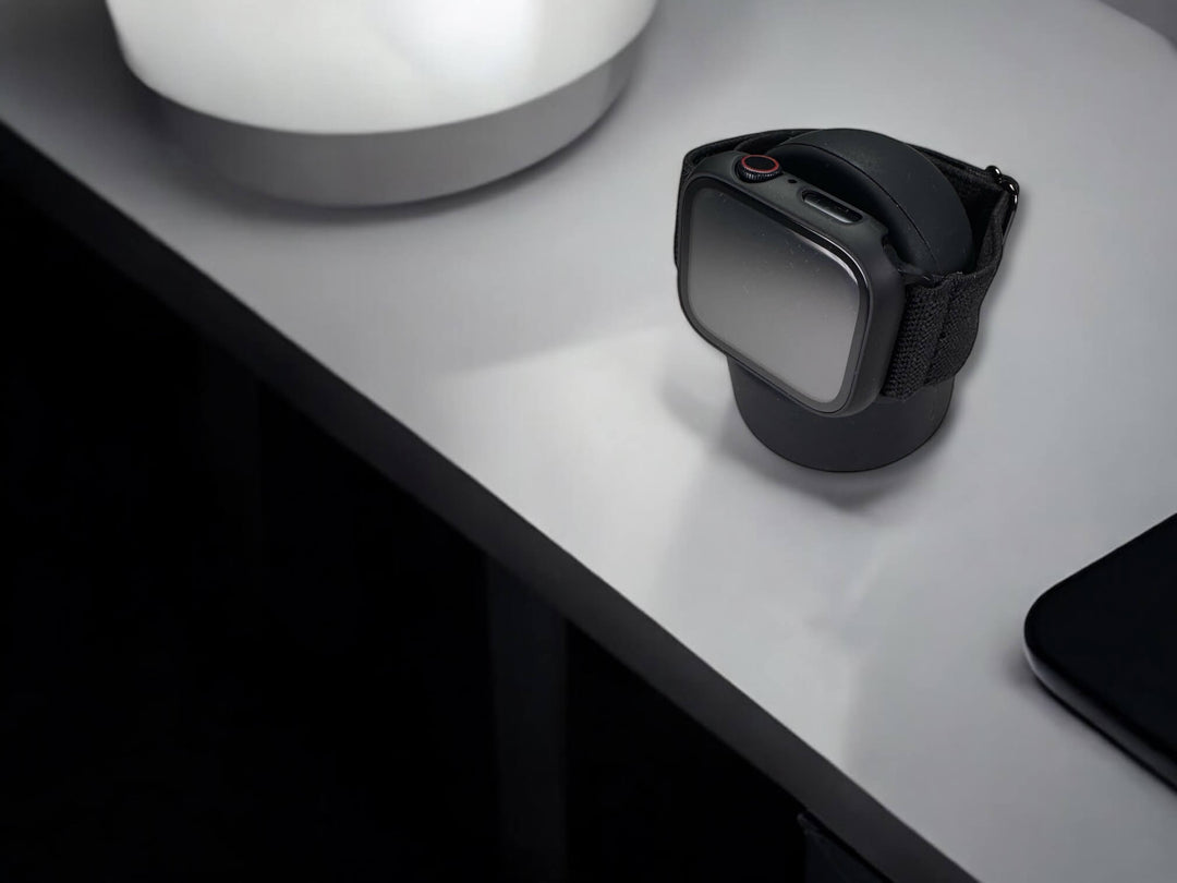 anhem silicone apple watch stand in black on table