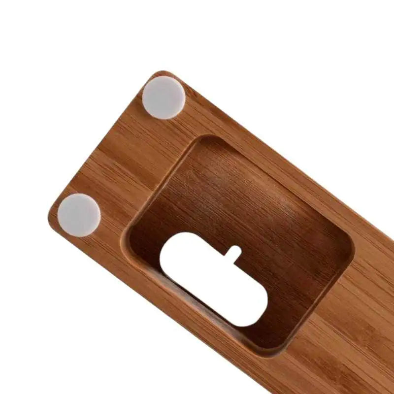 Close-up of the Anhem Bamboo Wood Charging Dock showing the cable outlet, designed as an effective Apple Watch charging station.  Bamboo Wood Charging Dock  anhem.myshopify.com