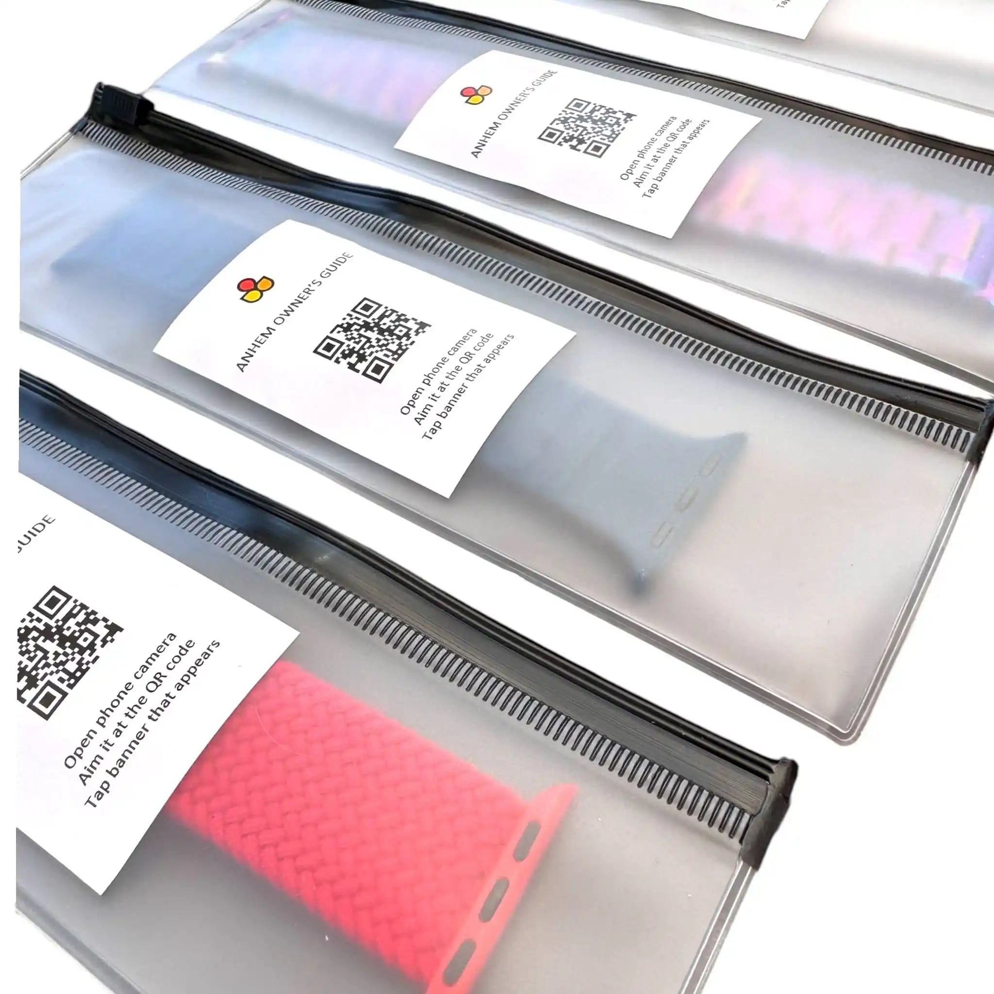 Close-up view of Anhem Reusable Gifting Pouches containing watch bands, showcasing multiple colors and the owner’s guide. Ideal Watch Band Pouch for stylish gifting.
