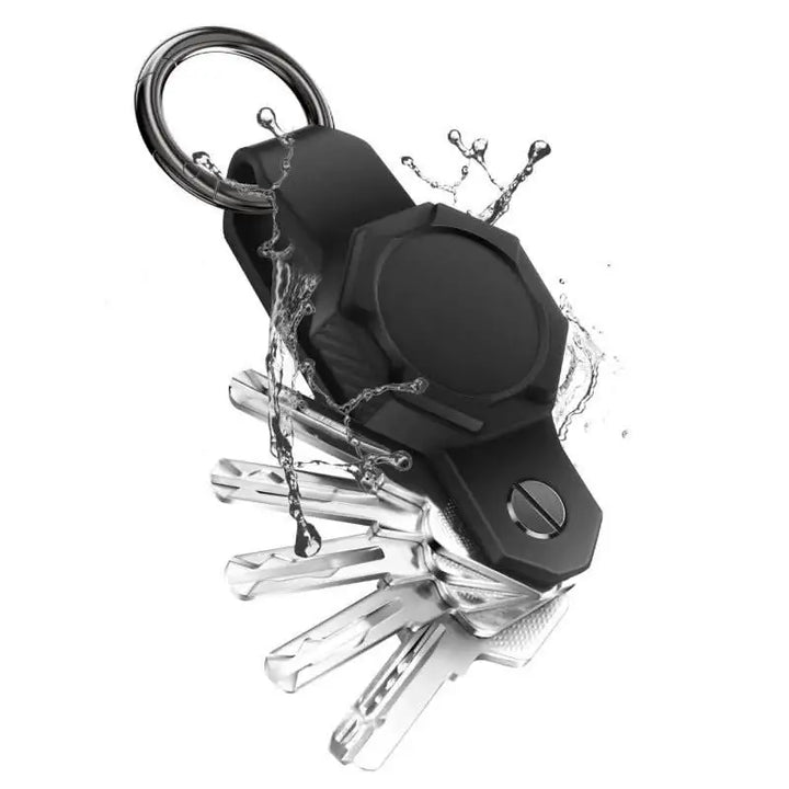 Anhem's Smart Key Case Holder & Organizer for Tag, featuring a sleek design with a black silicone finish, displaying keys and a water splash effect, ideal as an AirTag Keychain Holder.  Smart Key Case Holder & Organizer for Tag  anhem.myshopify.com  Black