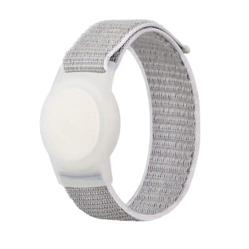 White Anhem Nylon Band for AirTag, a comfortable AirTag Bracelet designed for secure tracking of children and the elderly.  Nylon Band For Tracker Tag  anhem.myshopify.com  White