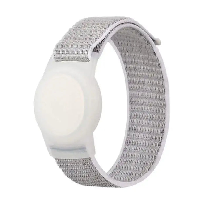 White Anhem Nylon Band for AirTag, a comfortable AirTag Bracelet designed for secure tracking of children and the elderly.  Nylon Band For Tracker Tag  anhem.myshopify.com  White