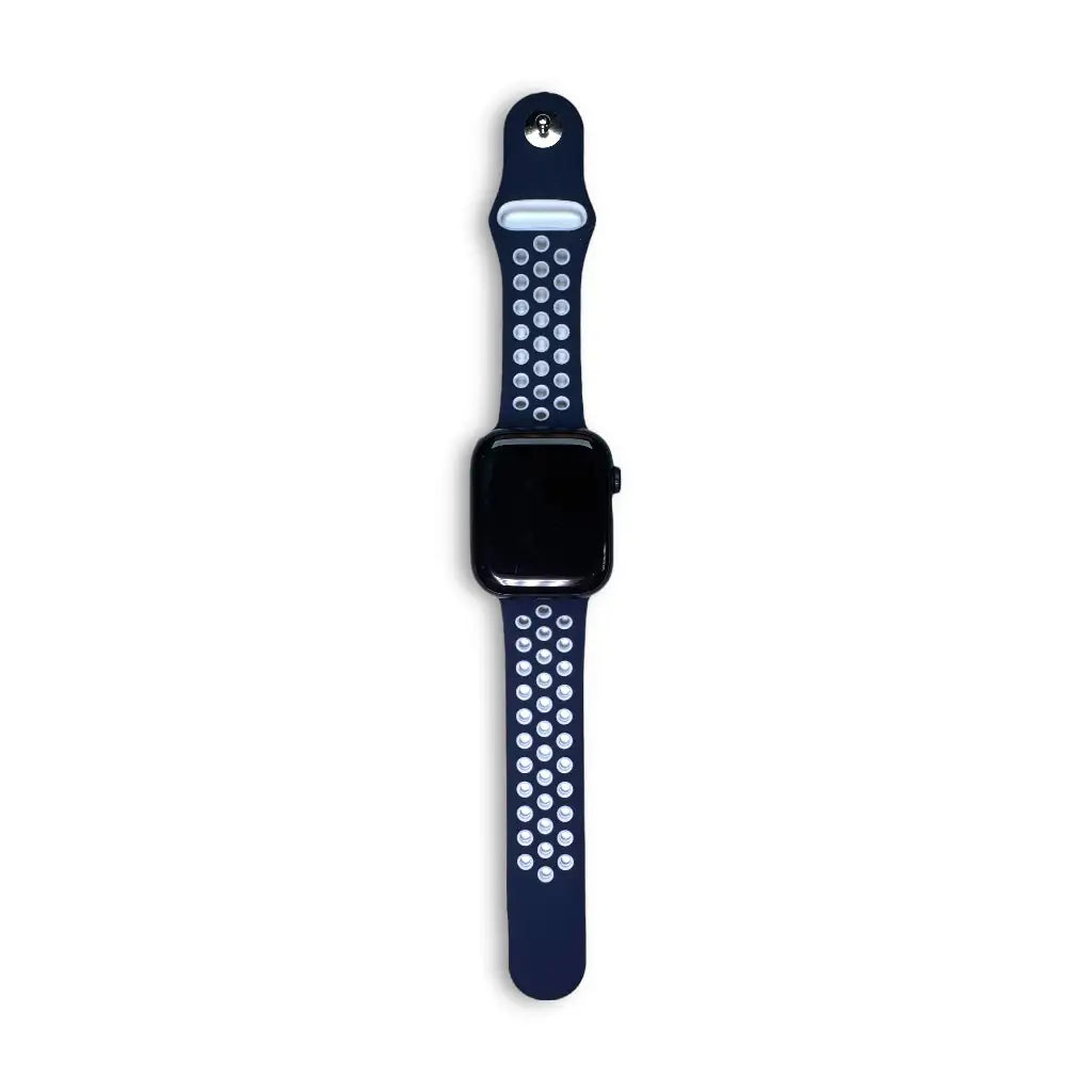 Anhem Aero silicone Apple Watch band in navy blue with breathable perforated holes and a secure pin-and-tuck closure