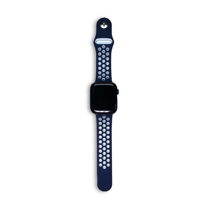 Anhem Aero silicone Apple Watch band in navy blue with breathable perforated holes and a secure pin-and-tuck closure