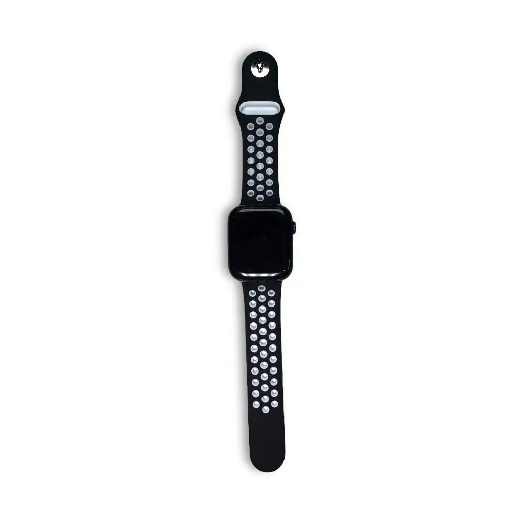 Anhem Aero silicone Apple Watch band in black with white perforated holes for breathability on a black watch face