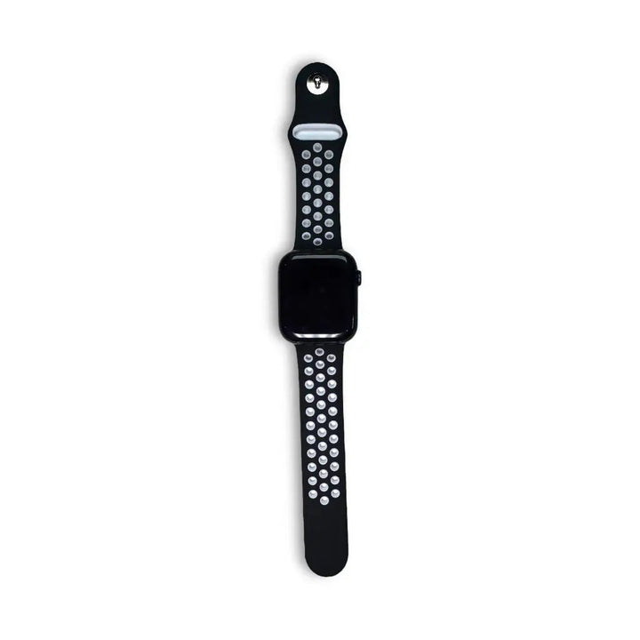 Anhem Aero silicone Apple Watch band in black with white perforated holes for breathability on a black watch face