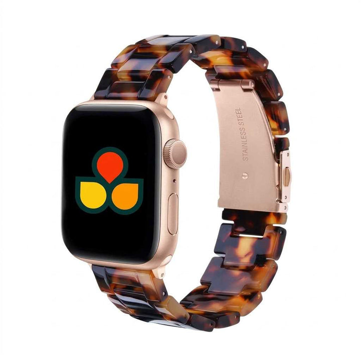 Anhem Amber Resin Apple Watch band with a translucent tortoiseshell pattern and rose gold stainless steel hardware.