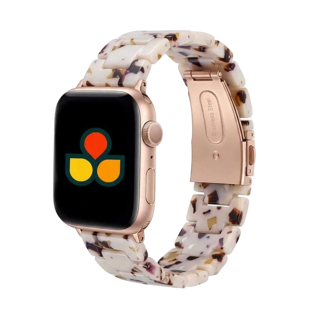Anhem Amber Resin Apple Watch strap with a translucent white and brown tortoiseshell pattern and metal clasp.