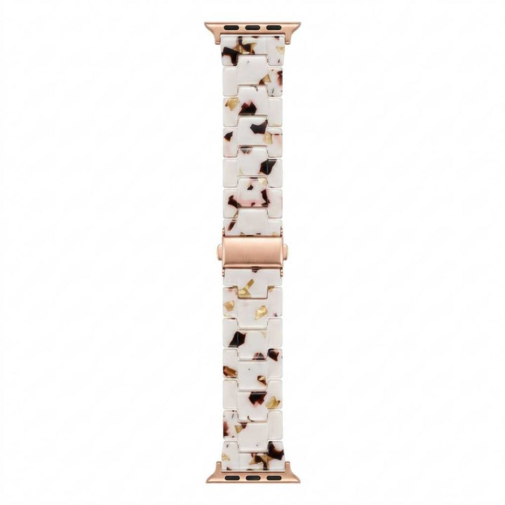 Anhem Amber Resin Apple Watch band featuring a translucent white, brown, and gold speckled pattern with rose gold hardware.