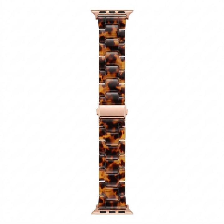 Anhem Amber Resin Apple Watch band featuring a translucent tortoiseshell pattern with a smooth, polished finish.