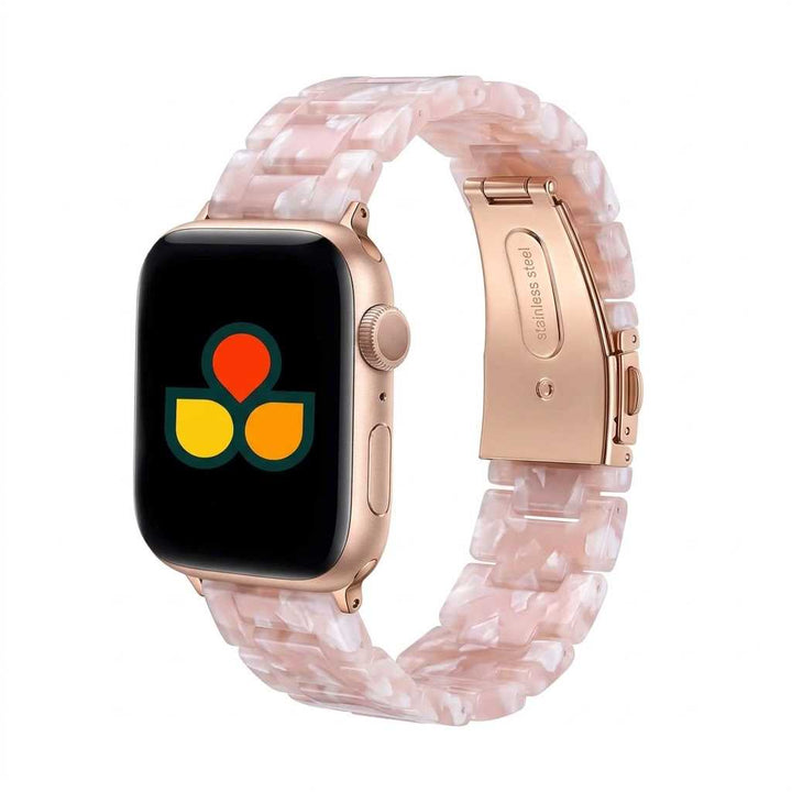 Anhem Amber Resin Apple Watch band in a translucent pink marble pattern with rose gold stainless steel hardware.