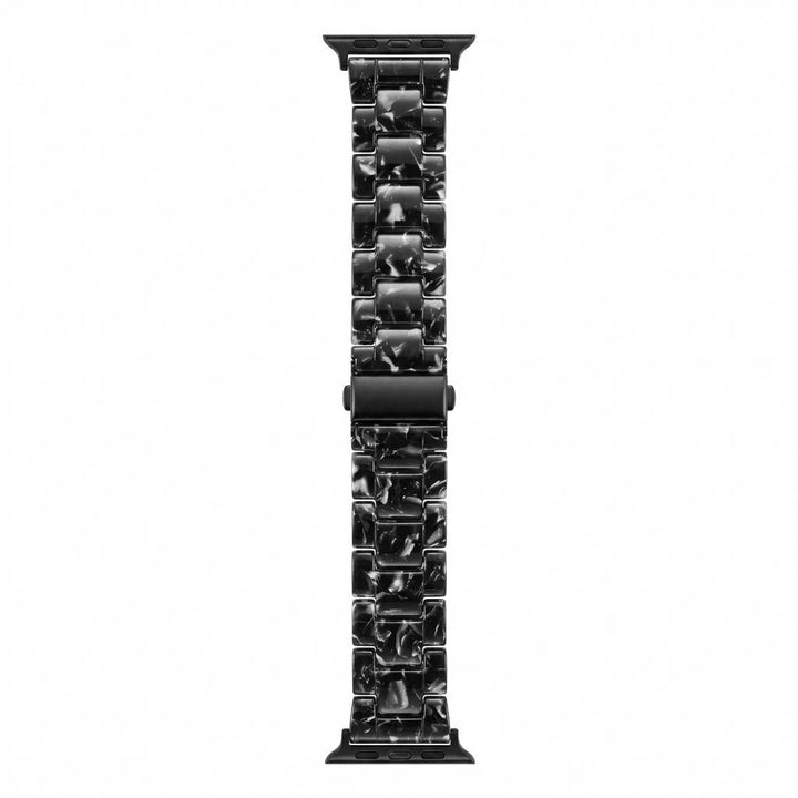 Anhem Amber Resin Apple Watch band in a black and white marbled pattern with a smooth, translucent finish.