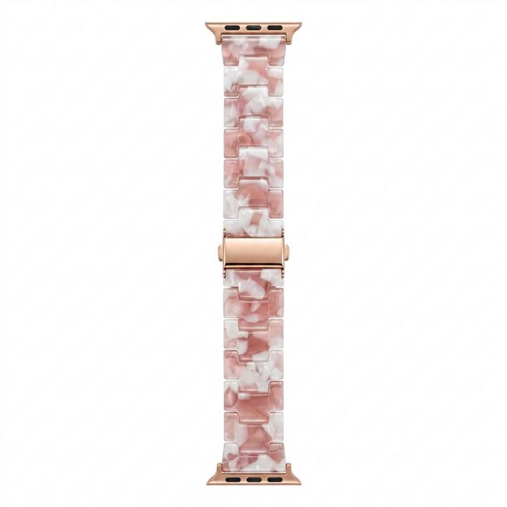 Anhem Amber Resin Strap for Apple Watch in a translucent pink and white marbled pattern with rose gold hardware.