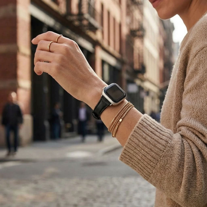 woman wearing a extra slim leather apple watch band wearing other bracelets