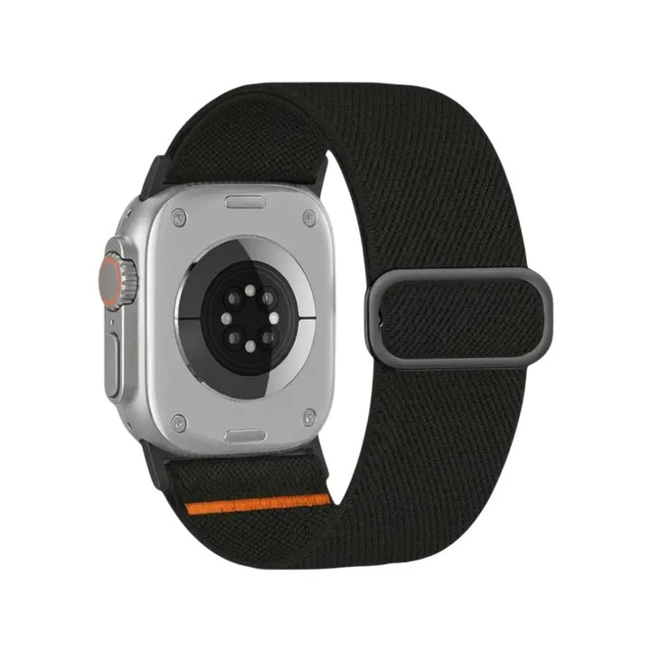 Anhem Ultra Nylon Strap in black for Apple Watch, featuring a breathable elastic band with an adjustable sliding buckle.
