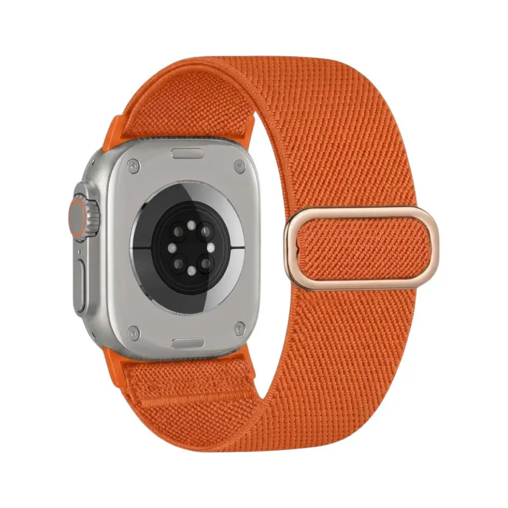 Anhem Ultra Nylon elastic watch band in bright orange with a metallic buckle, shown attached to an Apple Watch Ultra.