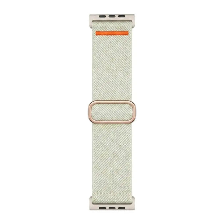 Anhem Ultra Nylon elastic Apple Watch band in light beige with an orange accent and metallic buckle for active wear.
