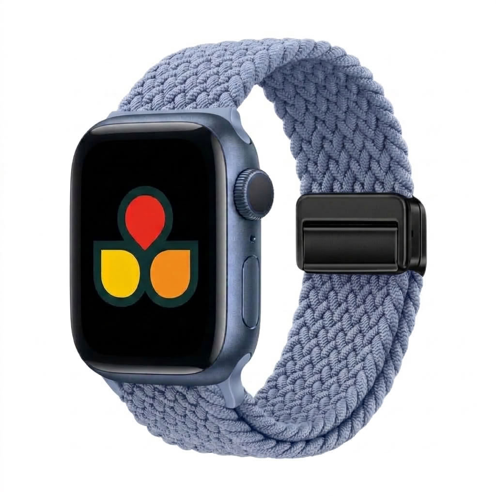 A apple watch with a textured, braided light blue band and a dark blue-gray aluminum case, shown on a plain white background. The watch face displays a colorful app icon.