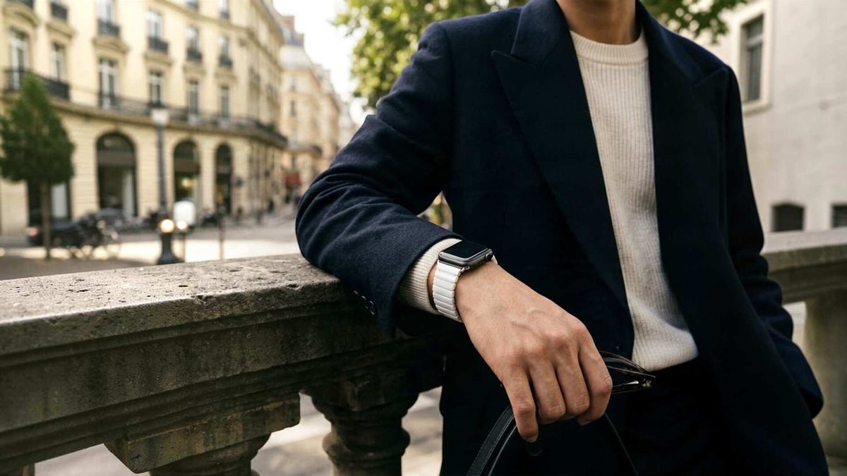 man wearing black luxe apple watch ceramic white band by bridge