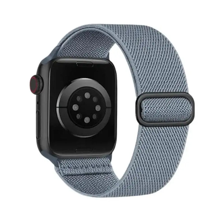 Gray Flex Nylon Band by Anhem for Apple Watch, designed with a stretchy material to ensure comfort during workouts.  Flex Nylon Strap  anhem.myshopify.com  Blue Gray / Black Buckle / 44/45/46/499MM (Large Watch)