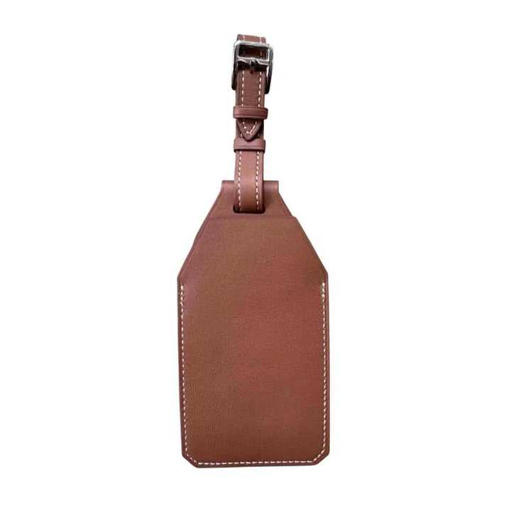 A simple and elegant back view of the Anhem AirTag Luggage Tag & Holder, crafted from durable vegan leather for stylish travel.  Luggage Tag & Holder for Tracker  anhem.myshopify.com