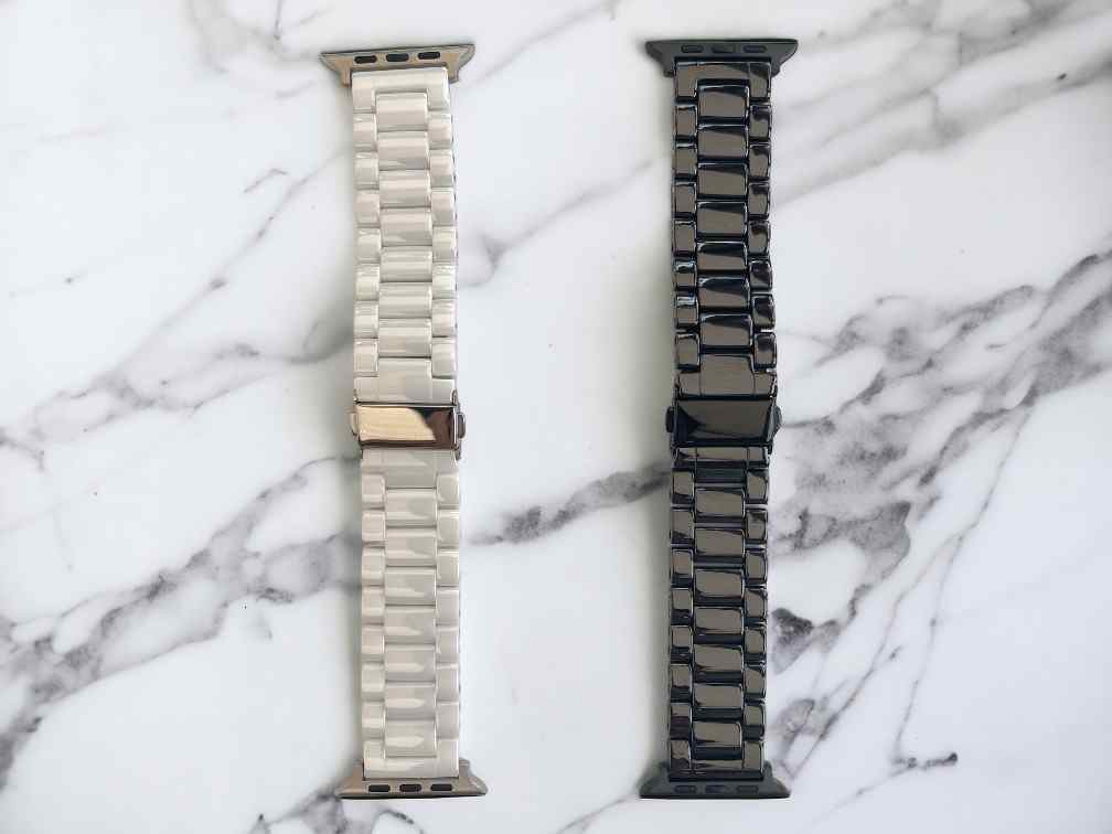 anhem classic ceramic apple watch bands laid flat in white and black colors